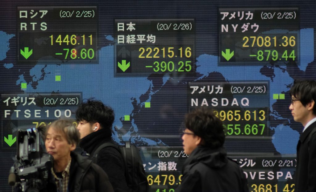 Japanese shares gained on Wednesday as hopes that the government would allow economic activity to resume in response to a decline in new coronavirus infections. (AFP)
