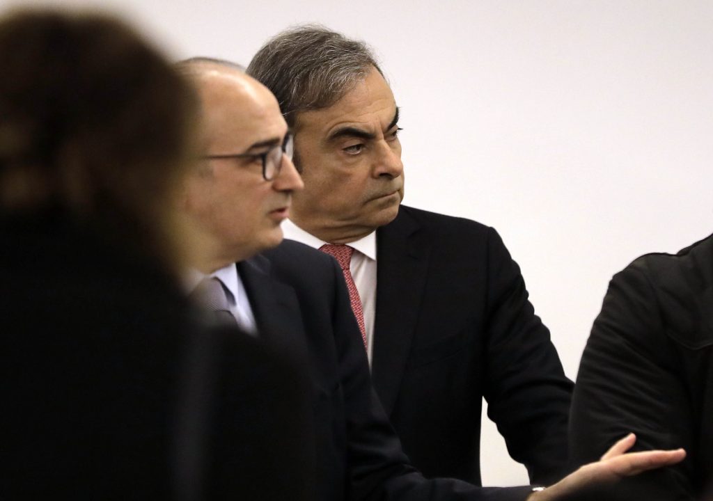 In this file photo former Nissan chief Carlos Ghosn (C) looks on upon his arrival at the Lebanese Press Syndicate for his highly anticipated press conference in the capital Beirut on January 8, 2020. (AFP)