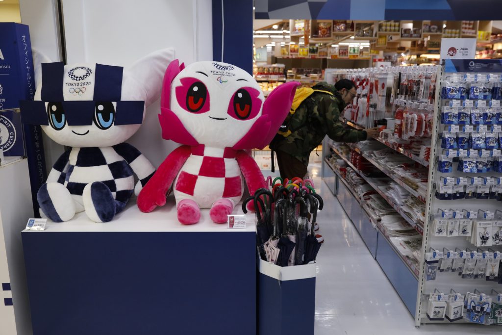 In this Jan. 8, 2020, file photo, dolls of the Tokyo Olympic and Paralympic mascots, Miraitowa and Someity, are on display at a Tokyo 2020 official shop in the Shinjuku district of Tokyo. Official Tokyo Olympic souvenir shops are drawing few customers these days. The pandemic and the fact the Olympics have been postponed for a year has wiped out almost all business. (AP)