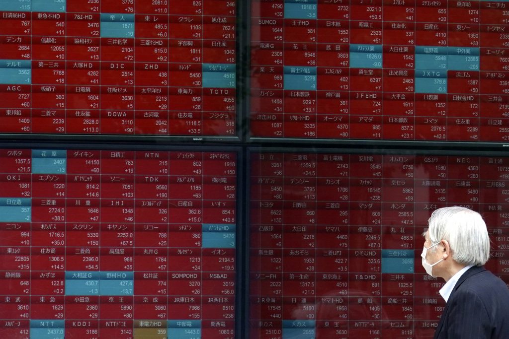 A man looks at an electronic stock board showing Japan's Nikkei 225 index at a securities firm in Tokyo, May. 11, 2020. (File photo/AP)