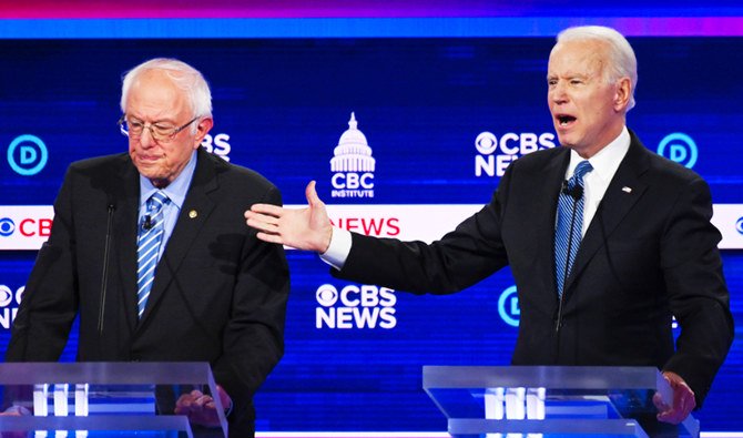 Former Vice President Joe Biden and Sen. Bernie Sanders during a debate. (AFP)