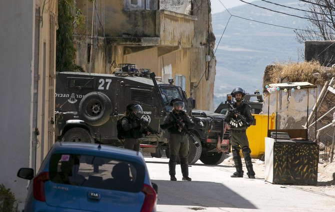 An Israeli soldier was killed by a rock hurled by a Palestinian during a raid in the occupied West Bank on Tuesday, an Israeli army spokeswoman said. (File/AFP)