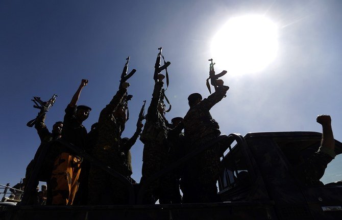 Newly recruited Houthi fighters chant slogans as they ride a military vehicle during a gathering in the capital Sanaa to mobilize more fighters to battlefronts to fight pro-government forces in several Yemeni cities, on January 3, 2017. (File/AFP)