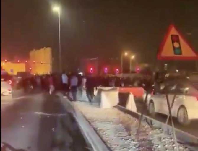 Images on social media showed more than 100 men blocking a main road in the Msheireb district of the capital Doha late on Friday. (Screenshot/Social Media)