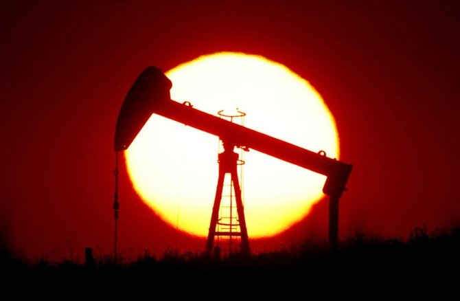 The sun sets behind an oil pump outside Saint-Fiacre, near Paris, France, September 17, 2019. (Reuters)