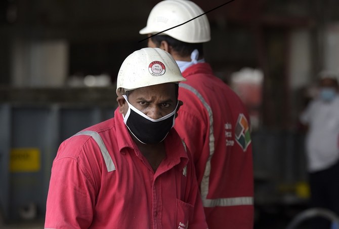 Bahrain has urged employers to ensure workers’ safety, especially in high-density accommodation. (File/AFP)