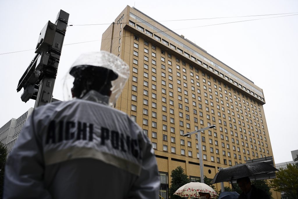 Aichi Police standing in front of the Nagoya Kanko hotel, Aichi prefecture, Nov. 22, 2019. (AFP)