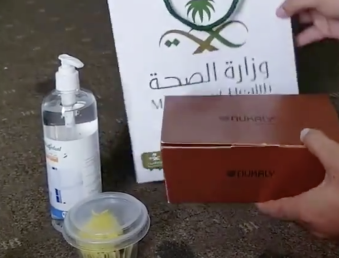 The video shows the man unpacking what are claimed to be gifts from bag. (Screengrab)