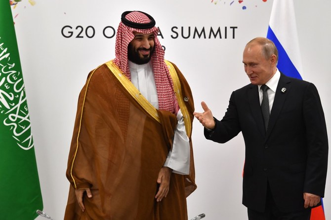 Crown Prince Mohammed bin Salman and Vladimir Putin agreed to closely cooperate on restricting oil output. (AFP/File)