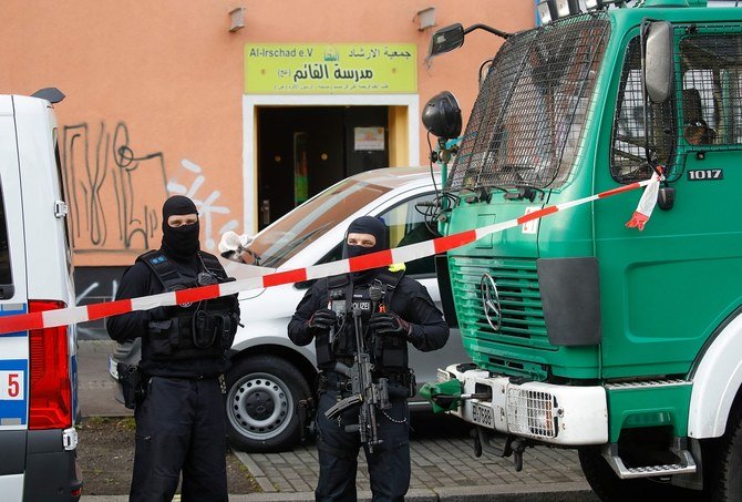 Police stand in front of Al-Irschad Mosque during a raid on April 30, 2020 in Berlin, Germany. (AFP)