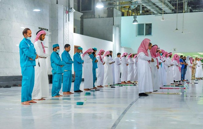 Muslims pray during the Laylat Al-Qadr, or Night of Power, the holiest night for Muslims, while practicing social distancing, following the outbreak of the coronavirus disease (COVID-19), during the fasting month of Ramadan, at the Grand Mosque in Makkah. (Reuters via SPA)