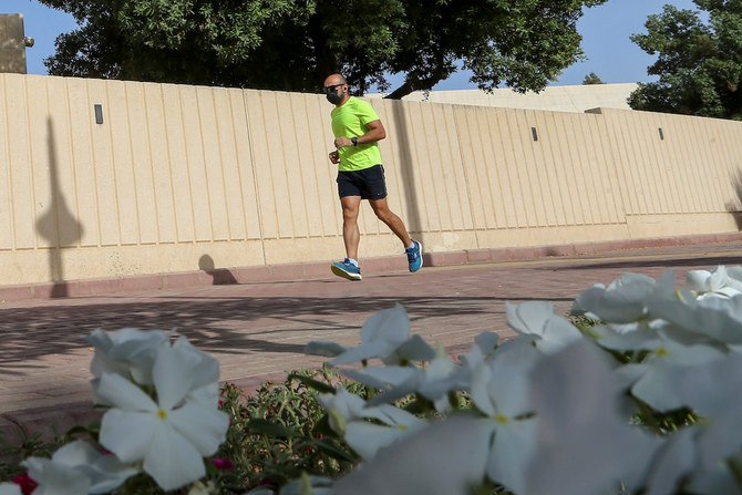 A man wears a protective face mask while jogging, following the outbreak of the coronavirus disease (COVID-19), in Riyadh, Saudi Arabia May 13, 2020. (Reuters)