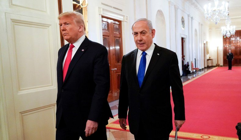 Donald Trump and Benjamin Netanyahu arrive at a news conference to discuss a new Middle East peace plan proposal, Jan. 28, 2020. (Reuters)