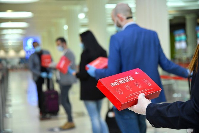 Face masks and protective gloves will have to be worn at all times. (Courtesy of Emirates)