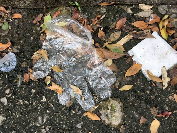 A protective glove is seen discarded on a sidewalk in the Lebanese capital Beirut on April 8, 2020. (AFP)