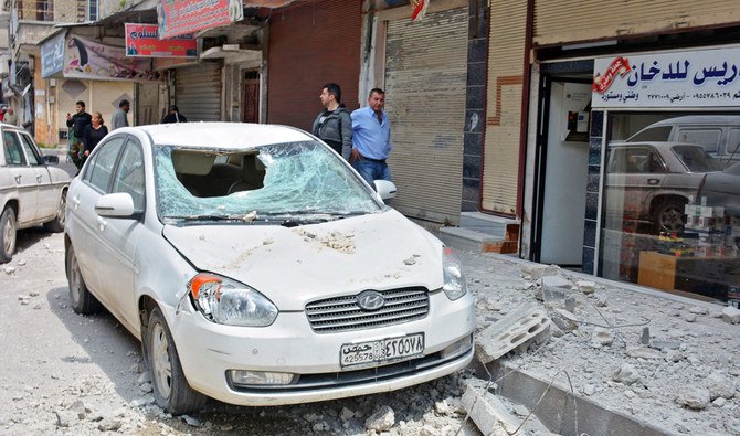 A handout picture released by the official Syrian Arab News Agency (SANA) on May 1, 2020, shows damages on a street after explosions rocked Syria's central city of Homs. (AFP)