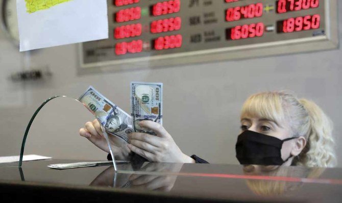 The Turkish lira fell to 7.26 against the dollar on Thursday, surpassing the previous record low of 7.24 reached during a currency crisis in August 2018.(AP Photo/Burhan Ozbilici)