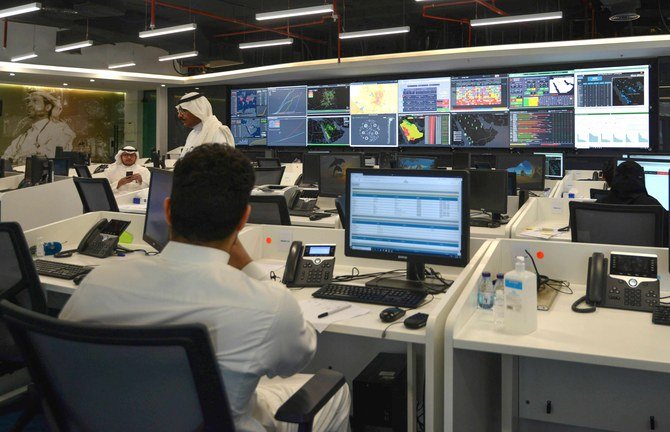 Employees work at the Saudi National Health Emergency Operations Center (NHEOC) in Riyadh monitoring the COVID-19 pandemic crisis on May 3, 2020. (AFP / FAYEZ NURELDINE)