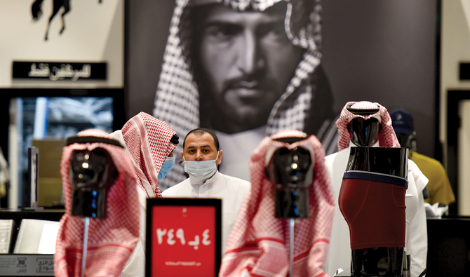 A man at a store in Riyadh. The Kingdom has firmly addressed the virus issue. (AFP)