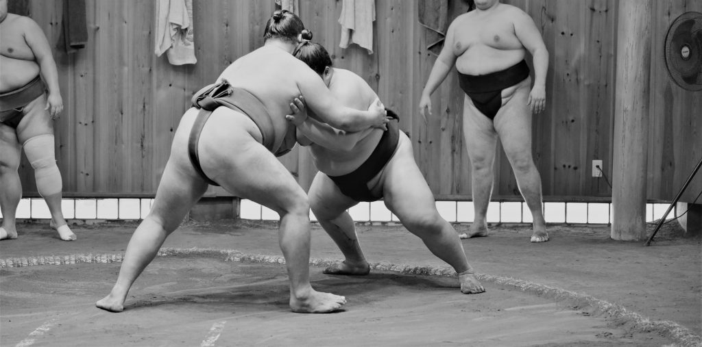 Sumo fighters and sumo wrestlers training in sumo stables preparing for the sumo tournament in Tokyo, Japan. (Shutterstock)