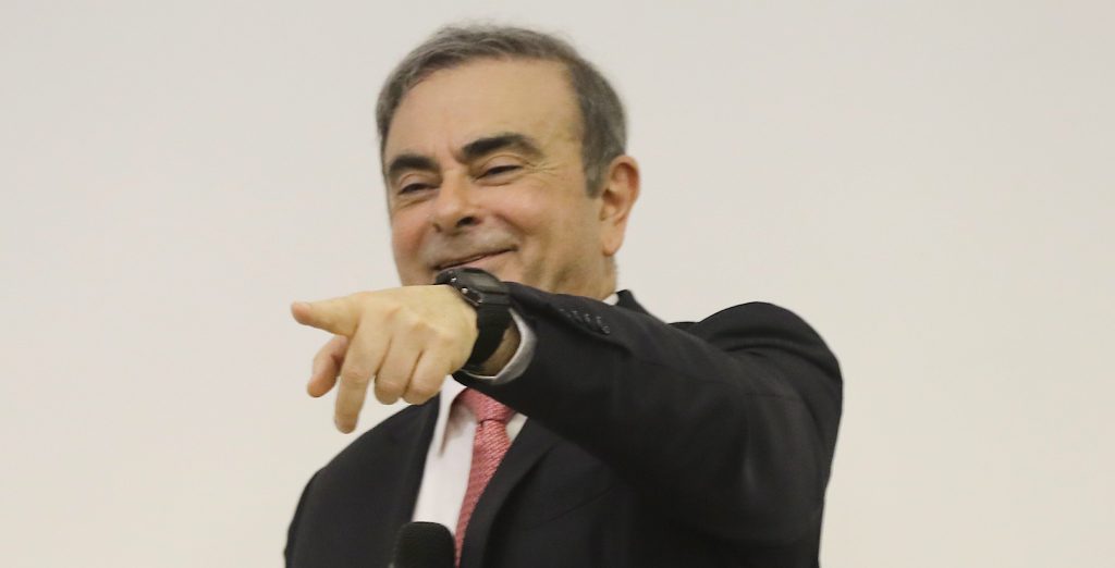 Former Renault-Nissan boss Carlos Ghosn gestures as he addresses a large crowd of journalists at the Lebanese Press Syndicate in Beirut on Jan. 8, 2020. (AFP)