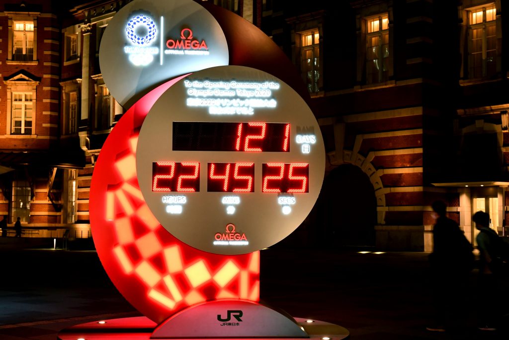 This picture taken on March 24, 2020 shows an electronic 2020 Tokyo Olympic Games countdown clock showing days until the opening ceremony of the Tokyo Olympics, outside Tokyo Station in Tokyo. (AFP)