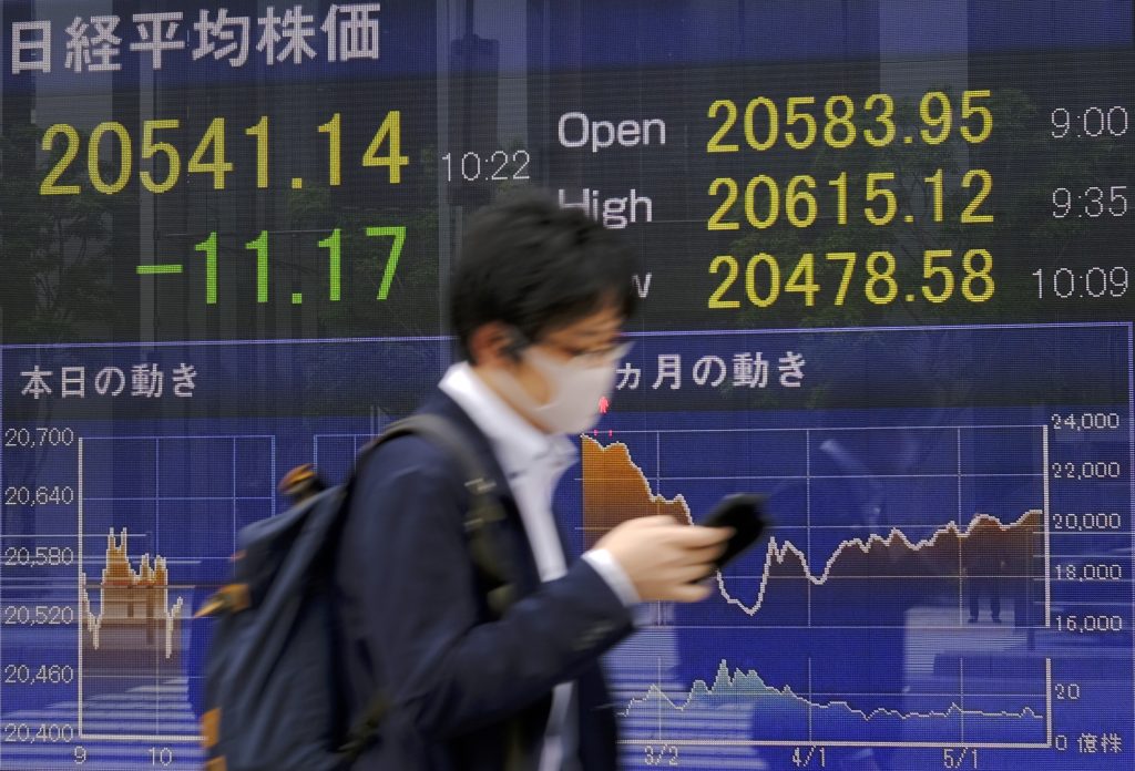 Japanese shares clawed back lost ground to end the morning trade almost flat on Wednesday. (AFP)