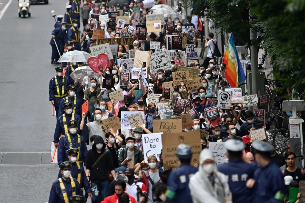 People take part in a Black Lives Matter protest march in central Tokyo on June 14, 2020. (AFP)