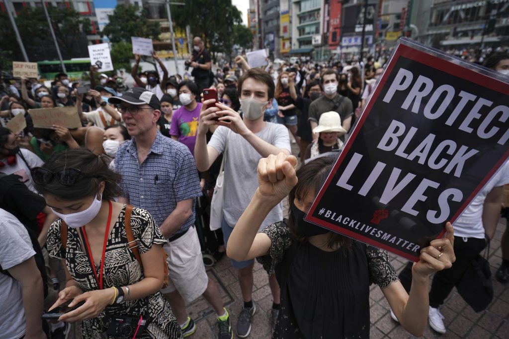 People gather to protest during a solidarity rally for the death of George Floyd Saturday, June 6, 2020, in Tokyo. Floyd died after being restrained by Minneapolis police officers on May 25. (AP Photo)