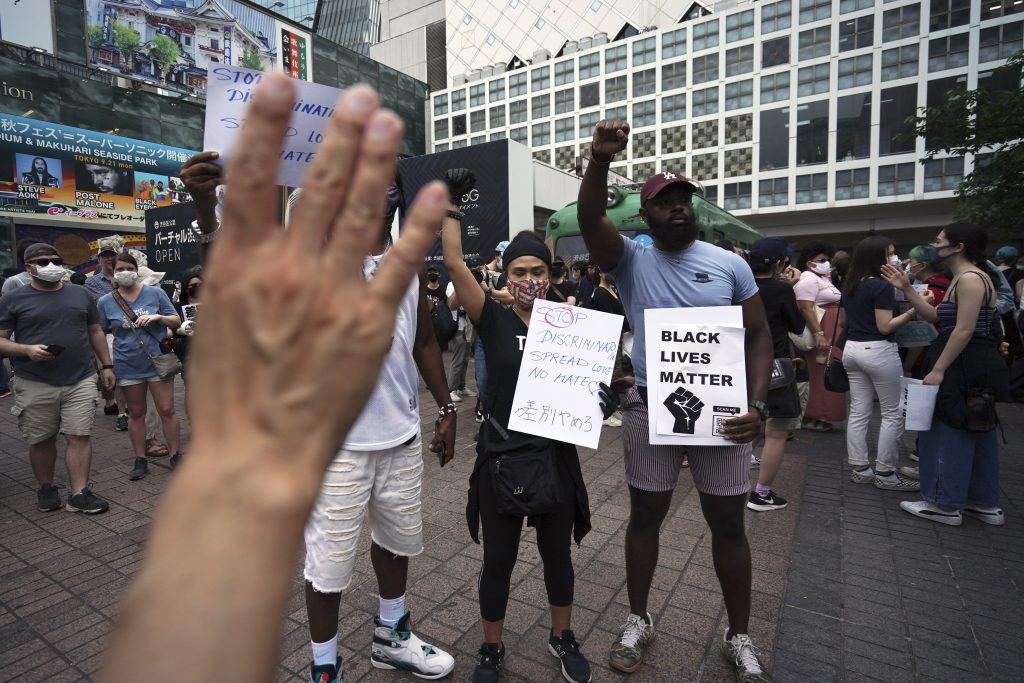 Protestors marched through the Shibuya and Ebisu districts in central Tokyo. (AP)