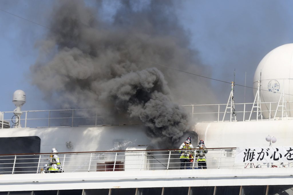 Smoke rises from Japanese cruise ship Asuka II docked in Yokohama Port, in Yokohama near Tokyo, June 16, 2020. (File photo/AP)