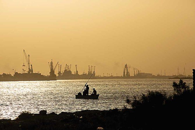 Iraqi workers have been forced to take unpaid leave or been laid off completely as energy firms cut costs because of plunging oil prices. (AFP)