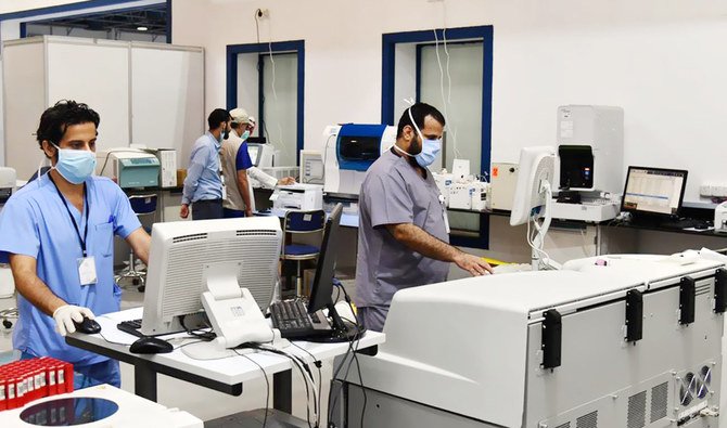 Health Ministry staff work at a temporary hospital in Jeddah. The hospital, established at the Jeddah International Exhibition and Convention Center, will treat COVID-19 patients with mild symptoms. It has opened with 20 beds. (SPA)