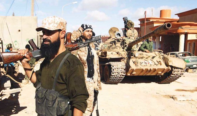  Members of the Libyan National Army hold a position during fighting against militants in Qanfudah, on the southern outskirts of Benghazi. (AFP/File)