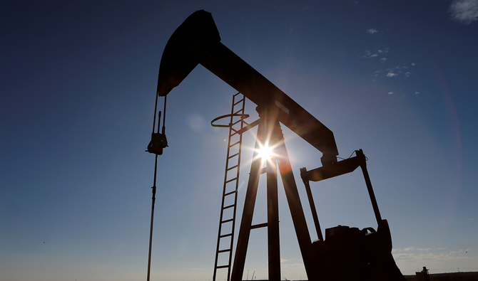 The sun is seen behind a crude oil pump jack in the Permian Basin in Loving County, Texas, US. (Reuters/File)