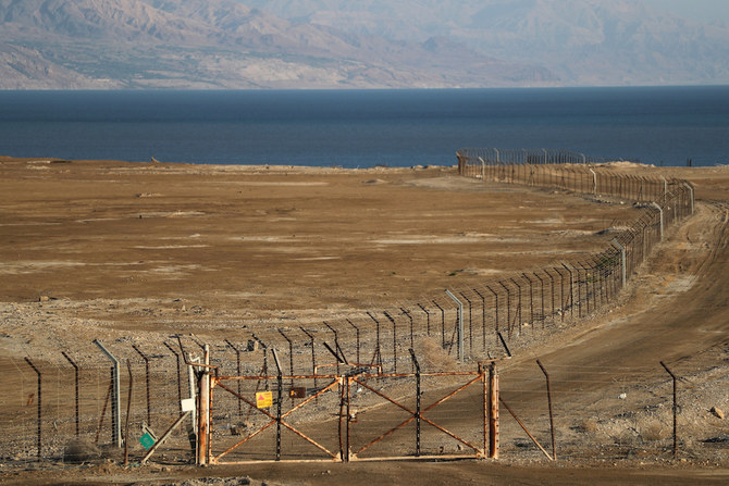 A view shows the Dead Sea with a border fence separating Jordan and the Israeli-occupied West Bank June 19, 2020. (Reuters)
