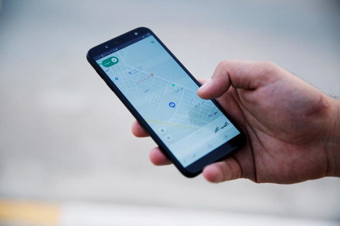 A customer uses the Careem application with his smartphone in Mosul, Iraq. (File/Reuters)