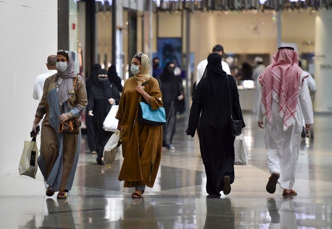 Saudis shop at the Panorama Mall in Riyadh last month. The easing of lockdown measures is starting to show in the economic data. (AFP/File)
