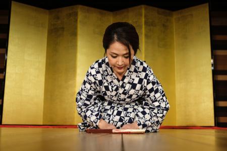 This picture shows geisha “Chacha” posing for a photo. (AFP)