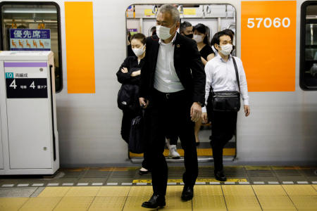 Passengers wearing protective masks get off a subway train at Shibuya station amid the coronavirus disease (COVID-19) outbreak in Tokyo, Japan, May 27, 2020. (Reuters)