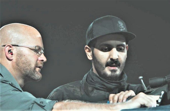 Above, former employee Matthew Pittard (left) with Sheikh Khaled bin Hamad bin Abdullah Al-Thani. (Supplied file photo)