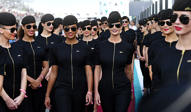 Abu Dhabi’s Etihad Airways has extended its salary cuts of between 25 percent and 50 percent to September. It also laid off some cabin crew and other staff from different departments. (AFP/File)