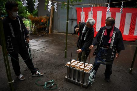 Pyrotechnicians prepare fireworks before the launching. (AFP)