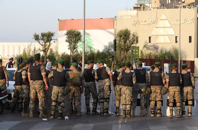 Lebanese army soldiers advance to disperse protesters amid clashes following a demonstration in central Beirut on June 6, 2020. (AFP)