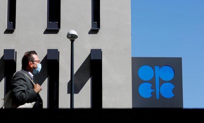 A person passes the logo of the Organization of the Petroleoum Exporting Countries (OPEC) in front of OPEC’s headquarters in Vienna, Austria, April 9, 2020. (Reuters)