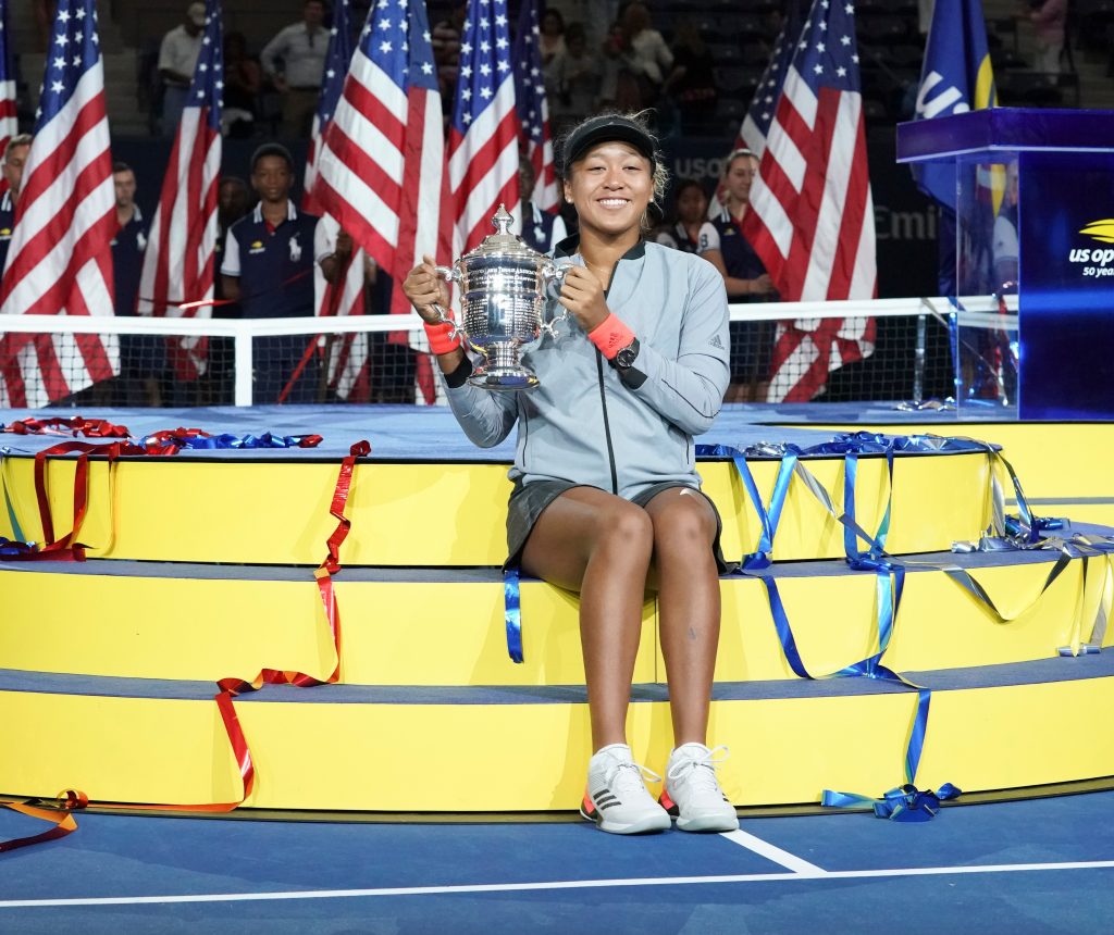 Naomi Osaka poses with trophy at USTA Billie Jean King National Tennis Center, New York, Sep. 8, 2018. (Shutterstock)