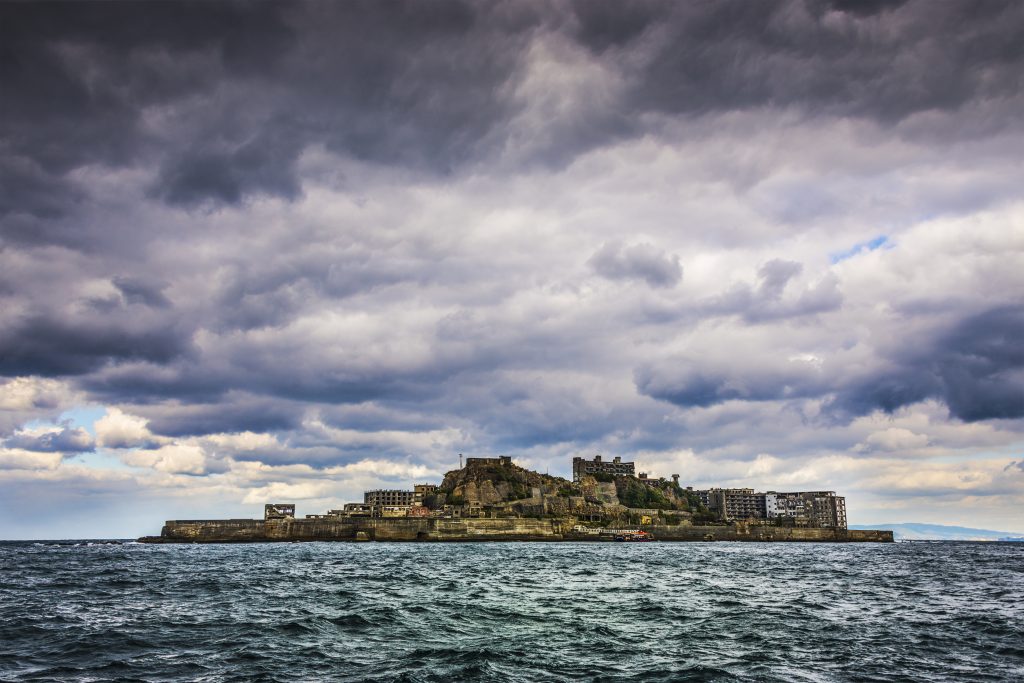 Gunkanjima, an abandoned coal mining island town off the Coast of Nagasaki in Kyushu Prefecture, Japan, a UNESCO world heritage site. (Shutterstock)