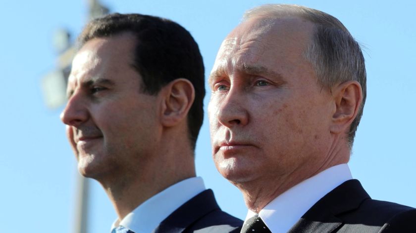 Russian President Vladimir Putin and Syrian President Bashar Assad at the Hmeimim Air Base in Syria, on Dec. 11, 2017. (AP Photo)