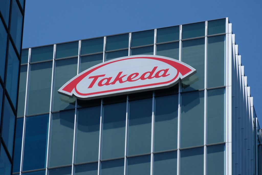 The logo of Takeda Pharmaceutical Company is displayed on the company's new building 
