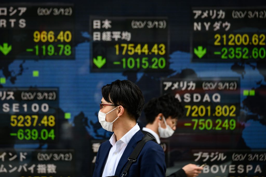 The benchmark Nikkei shares average closed lower on July 16 due to COVID-19 spikes. (AFP).